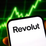 Hand,Holding,Smartphone,With,Revolut,App,Displaying,On,Screen.,In